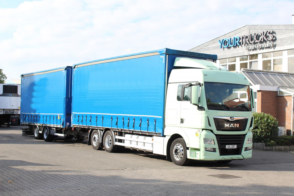 MAN TGX 26.460 Retarder Jumbo-Zug 120M3 Durchlade - Curtainsider truck: picture 1 MAN TGX 26.460 Retarder Jumbo-Zug 120M3 Durchlade - Curtainsider truck: picture 1