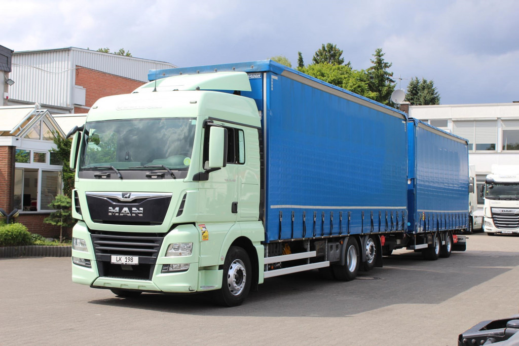 MAN TGX 26.460 Retarder Jumbo-Zug 120M3 Durchlade - Curtainsider truck: picture 1 MAN TGX 26.460 Retarder Jumbo-Zug 120M3 Durchlade - Curtainsider truck: picture 1