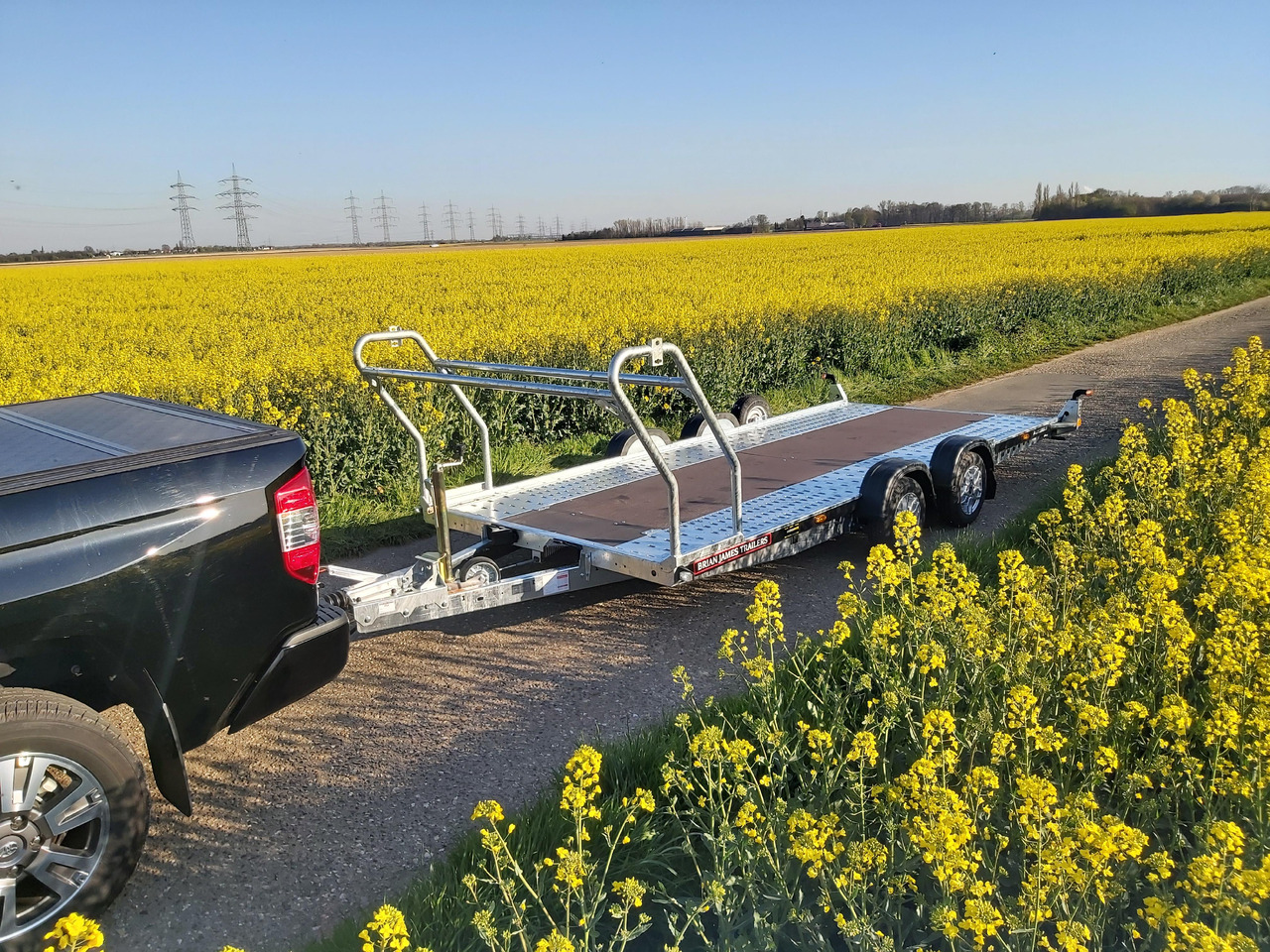 Brian James A4 Transporter 500x200cm blackline Alufelgen easy glide Rampen 240cm Reifenregal 3000kg - Autotransporter trailer: picture 2 Brian James A4 Transporter 500x200cm blackline Alufelgen easy glide Rampen 240cm Reifenregal 3000kg - Autotransporter trailer: picture 2