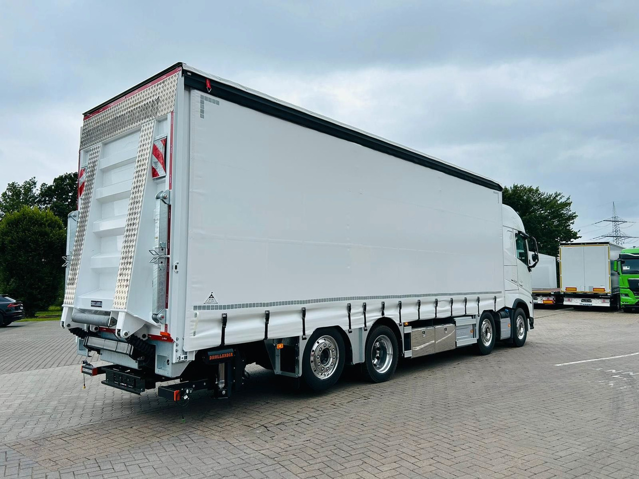 Volvo FH 500 Gabelstaplertransporter LBW Dhollandia 9t - Truck: picture 1 Volvo FH 500 Gabelstaplertransporter LBW Dhollandia 9t - Truck: picture 1