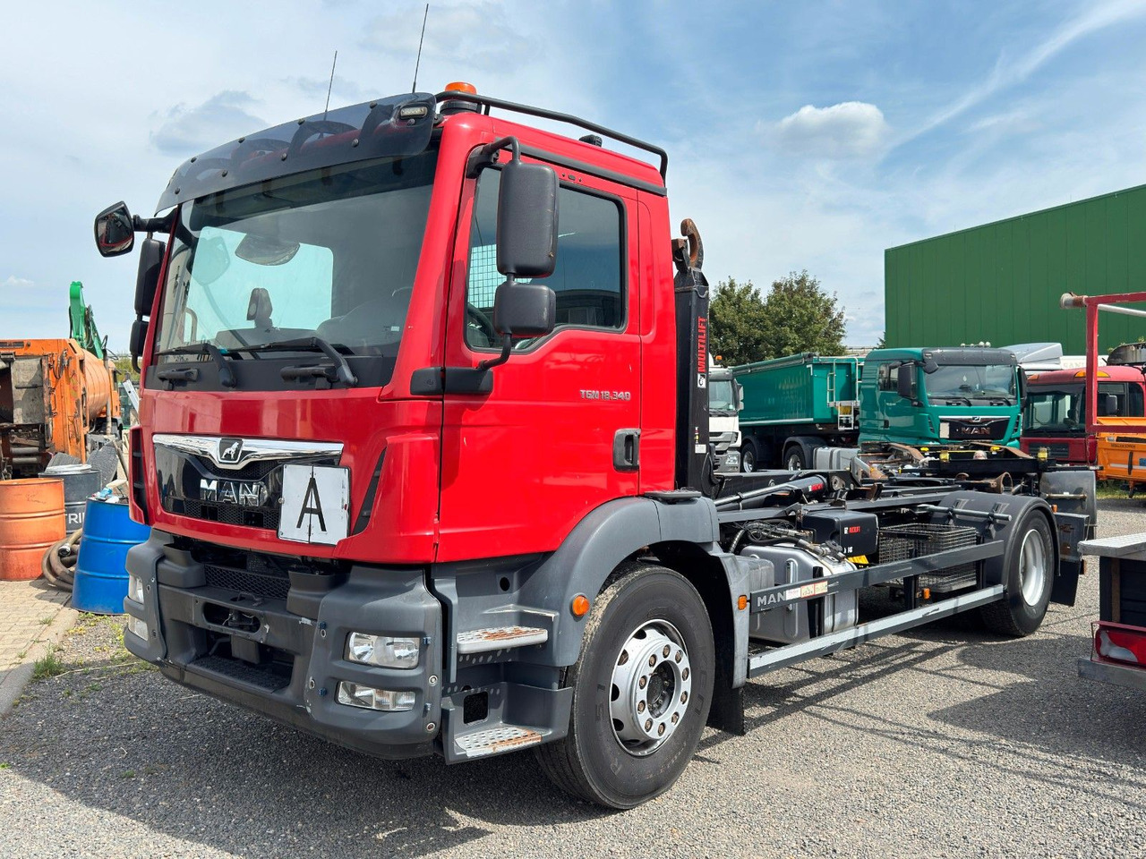 MAN 18.340 HIAB mit hydr. C-Verr. | Klima | Sperrdif - Hook lift truck: picture 1 MAN 18.340 HIAB mit hydr. C-Verr. | Klima | Sperrdif - Hook lift truck: picture 1