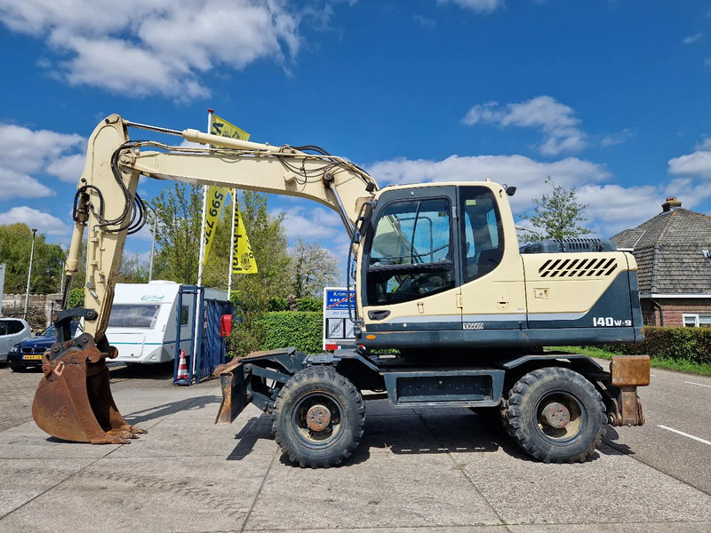 Hyundai Robex 140W-9 met airco - Wheel excavator: picture 1 Hyundai Robex 140W-9 met airco - Wheel excavator: picture 1