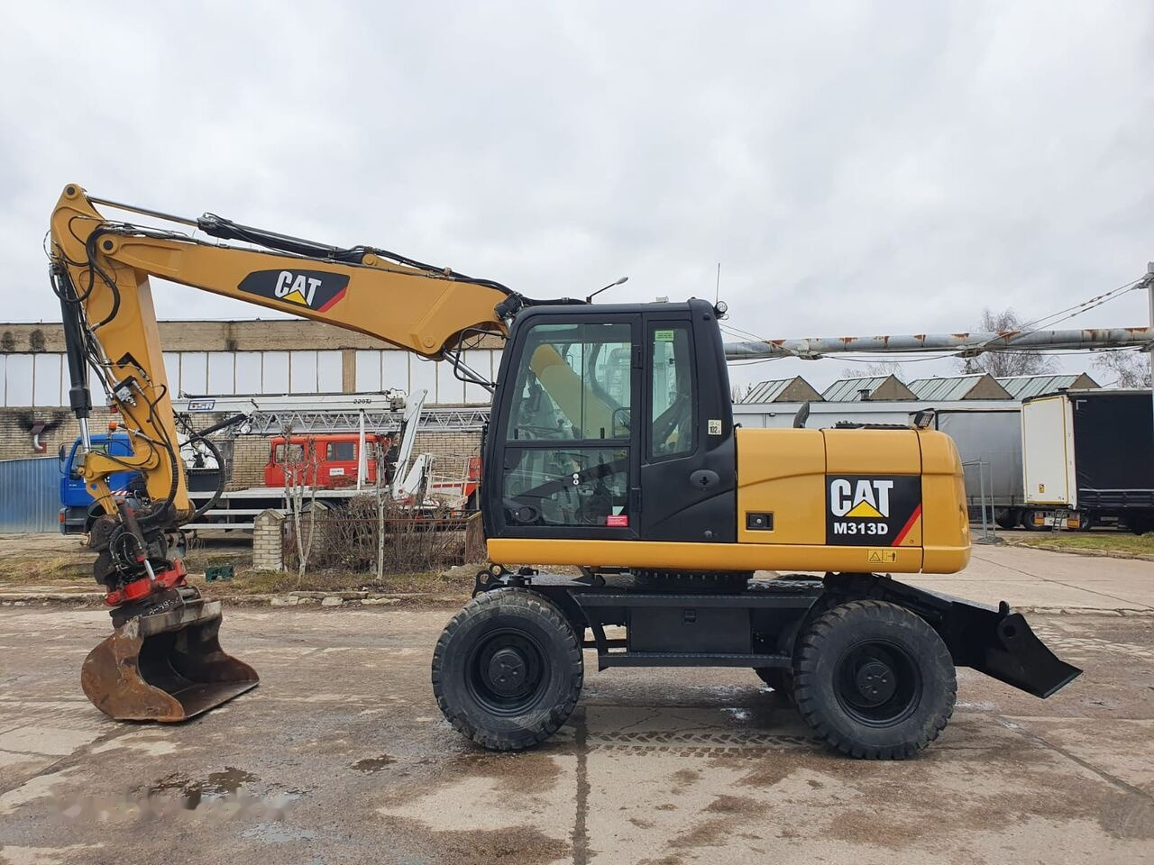 Caterpillar M 313 D Tiltrotator - Wheel excavator: picture 1 Caterpillar M 313 D Tiltrotator - Wheel excavator: picture 1