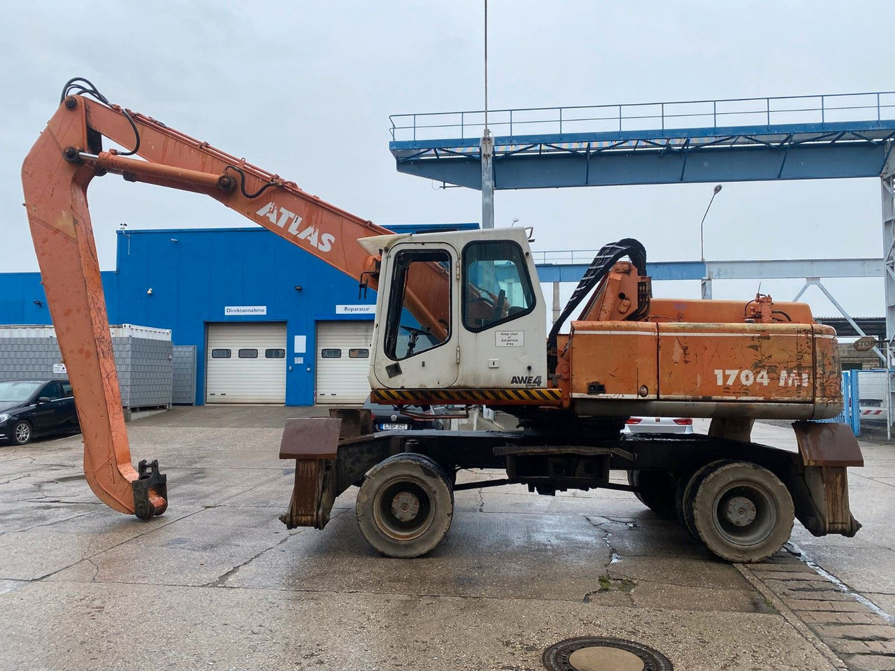 Atlas 1704 MI mit Greifer Umschlagbagger Lang - Wheel excavator: picture 1 Atlas 1704 MI mit Greifer Umschlagbagger Lang - Wheel excavator: picture 1