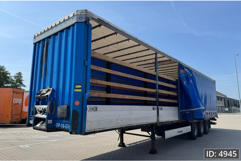 Krone SD / Sideboards / Drum brakes / DHOLLANDIA 2000KG - Curtainsider semi-trailer: picture 1 Krone SD / Sideboards / Drum brakes / DHOLLANDIA 2000KG - Curtainsider semi-trailer: picture 1