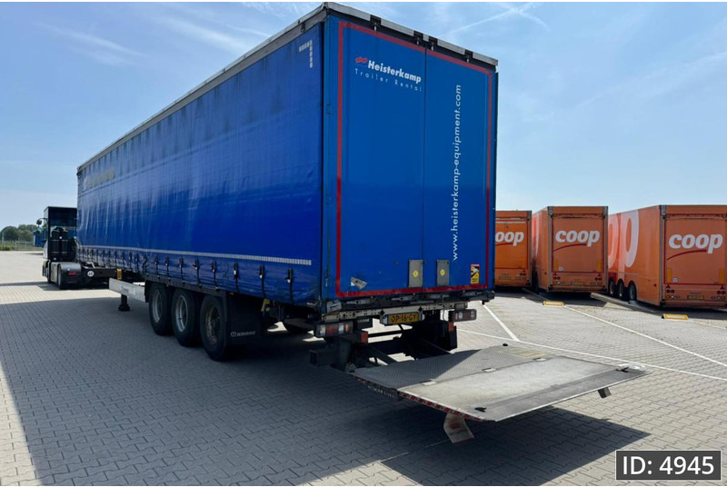 Krone SD / Sideboards / Drum brakes / DHOLLANDIA 2000KG - Curtainsider semi-trailer: picture 3 Krone SD / Sideboards / Drum brakes / DHOLLANDIA 2000KG - Curtainsider semi-trailer: picture 3