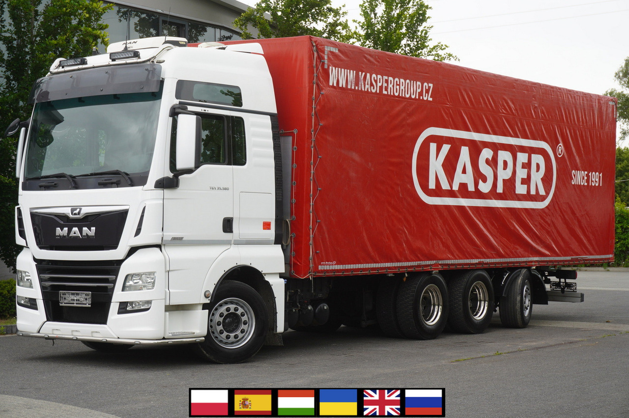 MAN TGX 35.580 E6 8x4 /4 / 23 EPAL tarp superstructure / 4th axle steered - Curtainsider truck: picture 1 MAN TGX 35.580 E6 8x4 /4 / 23 EPAL tarp superstructure / 4th axle steered - Curtainsider truck: picture 1