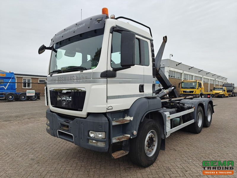 MAN TGS-TGX 26.440 6x4 Dagcabine Euro5 - AJK 20T HaakarmSysteem - Volledig Bladgeveerd - Naafreductie - Handgeschakeld - Hook lift truck: picture 1 MAN TGS-TGX 26.440 6x4 Dagcabine Euro5 - AJK 20T HaakarmSysteem - Volledig Bladgeveerd - Naafreductie - Handgeschakeld - Hook lift truck: picture 1