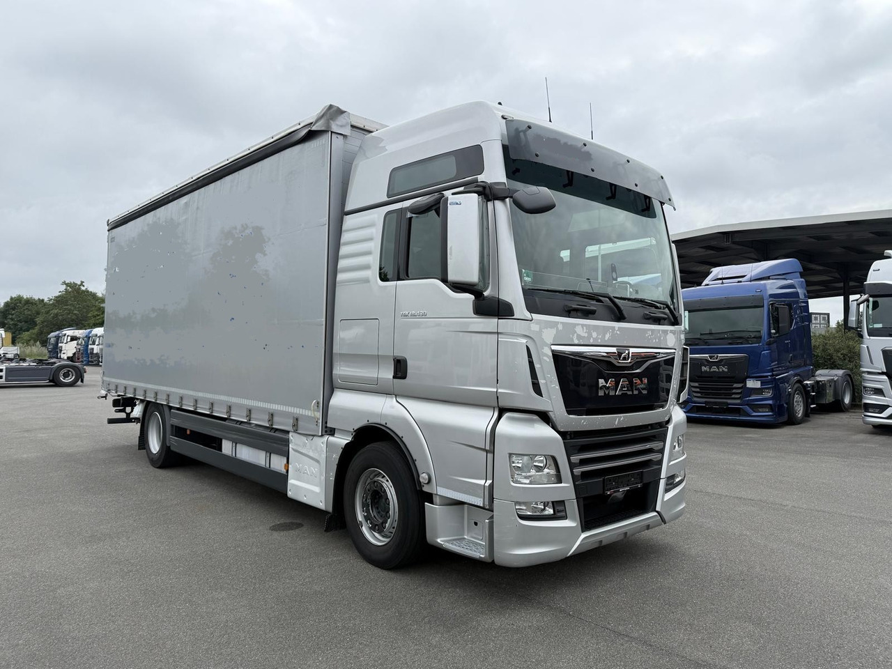 MAN 18.430 LL TGX E6 (Tauliner) - Curtainsider truck: picture 1 MAN 18.430 LL TGX E6 (Tauliner) - Curtainsider truck: picture 1